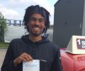 Jarvis with Driving test pass certificate
